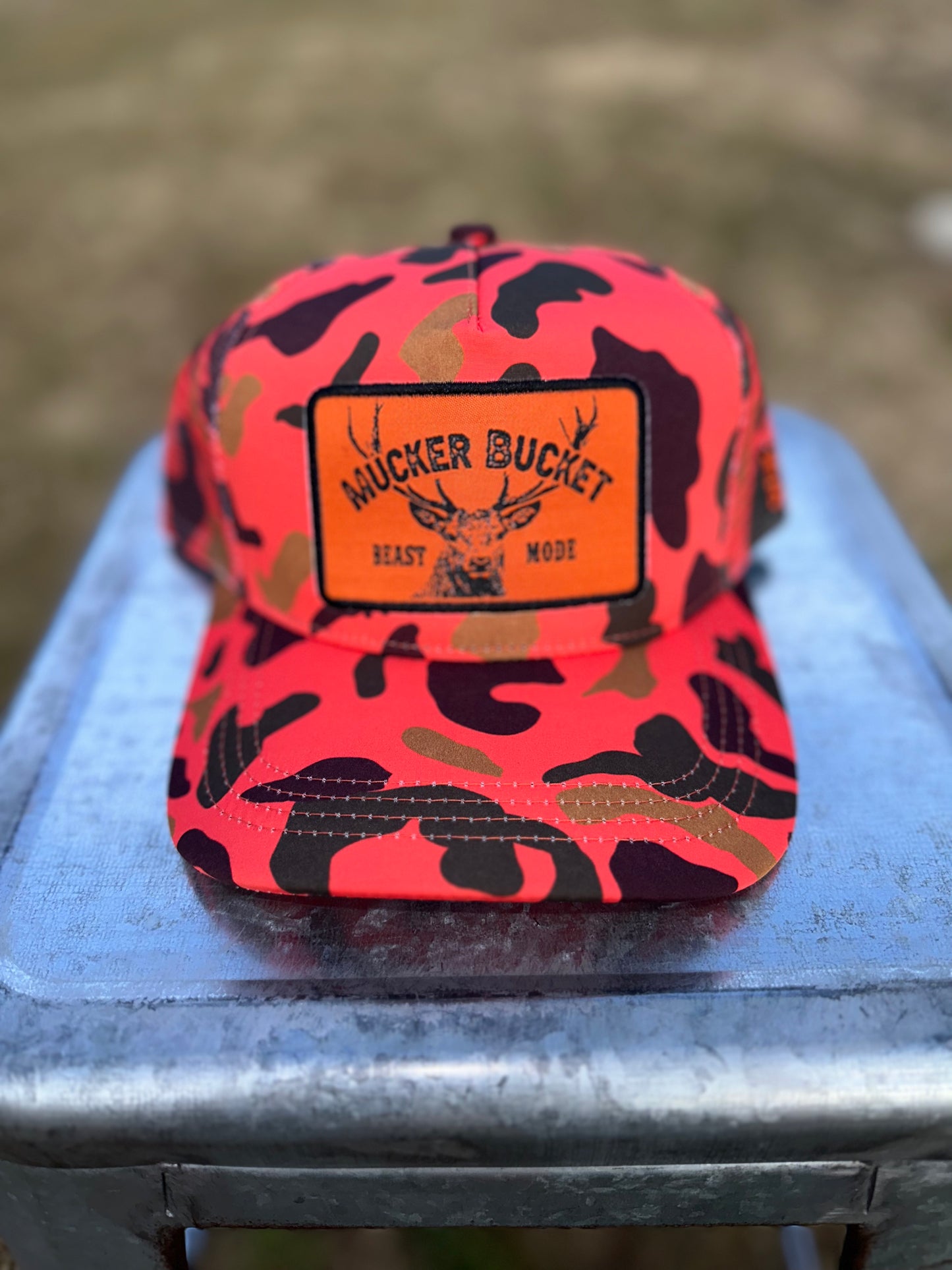 Mucker Bucket Beast Mode Orange Camo Hat